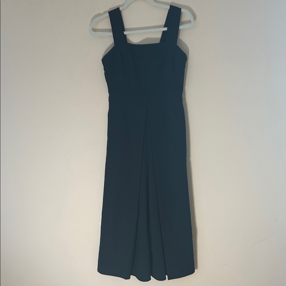 Culottes style black dress. 2side pockets. Zipper in back.